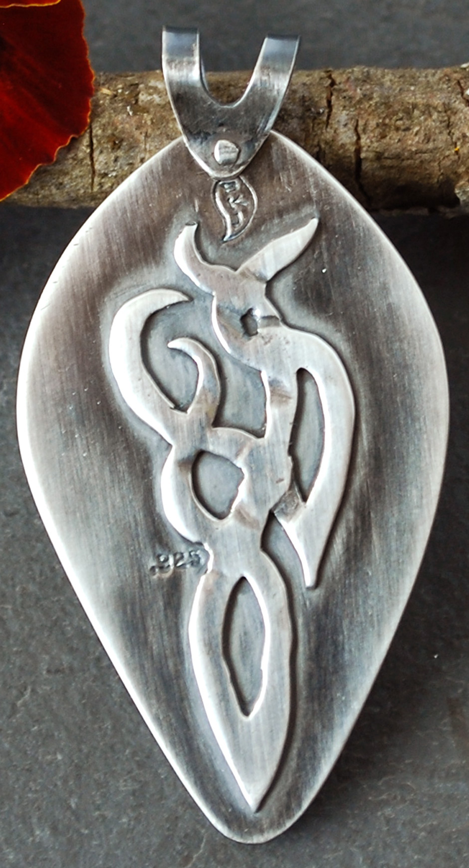 Flame agate pendant back with silver smoke tendrils