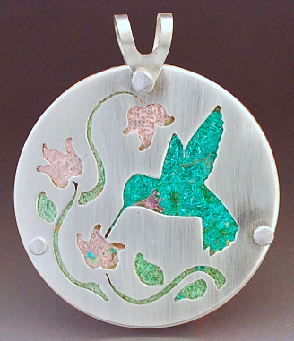 Pendant with hummingbird and flowers