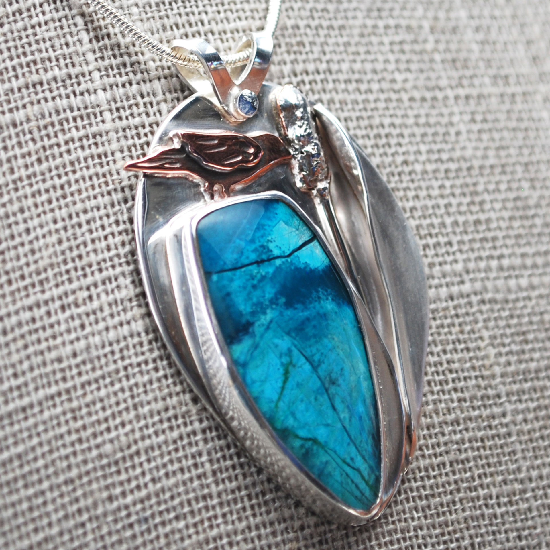 Chrysocolla Pendant with Bird and Cattail close-up angle