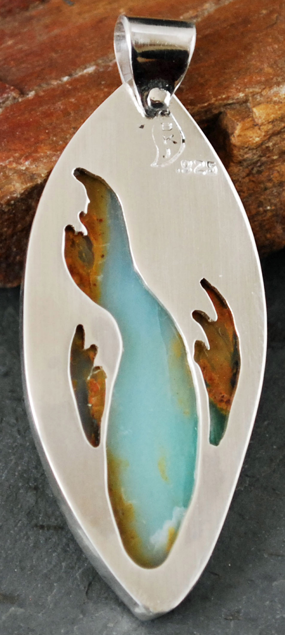 Peruvian blue opal pendant back with fish cut out