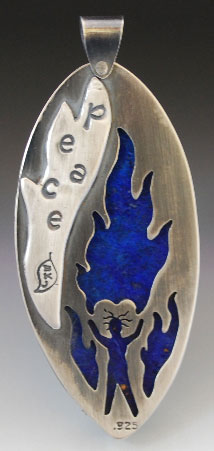 Back of the peace flame pendant, with cut out of man and flames