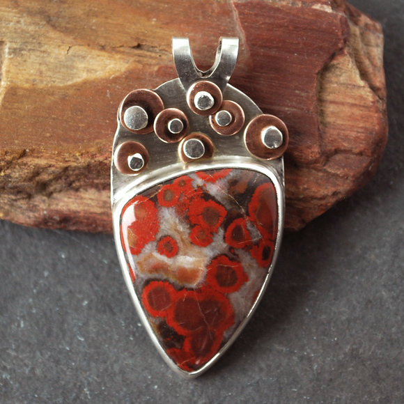 Poppy jasper pendant with copper and silver riveted discs