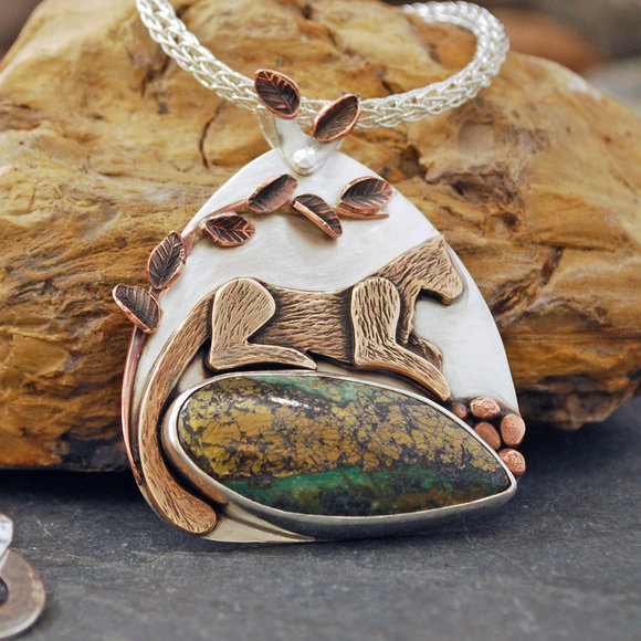 Silver pendant with Golden Eclipse Malachite, bronze cougar, copper branch and leaves. Hand made silver Viking Knit chain.