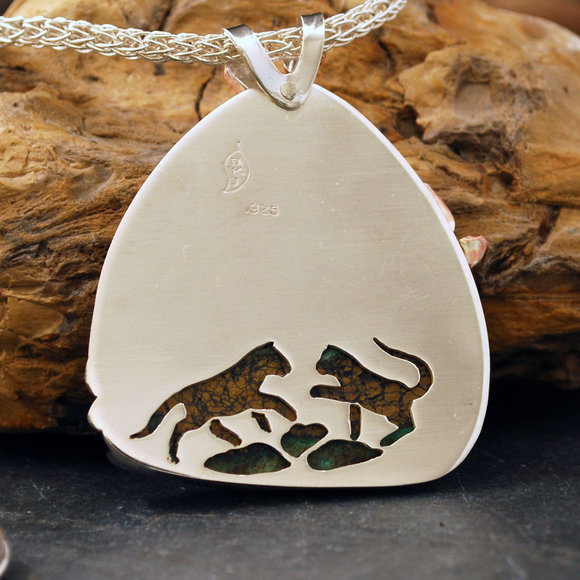Back of cougar pendant