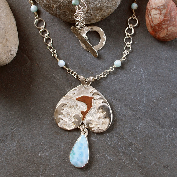 Silver pendant with Larimar and copper dolphin. Handmade chain with graduating links, larimar beads (links meant to represent bubbles)