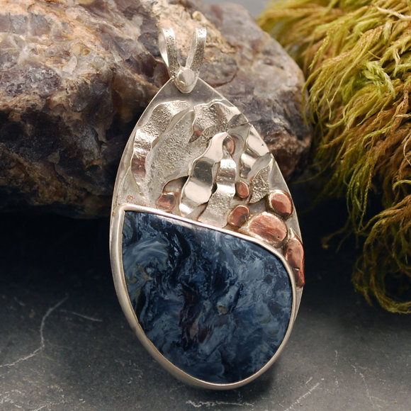 Silver pendant with Pietersite, layered silver water flowing over copper rocks