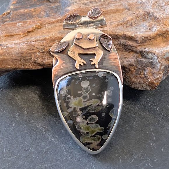 Silver pendant with Lilypad jasper, bronze frog, copper log and leaves.