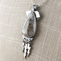 Graveyard Point Plume Agate Pendant with Lightning Bolts, angle
