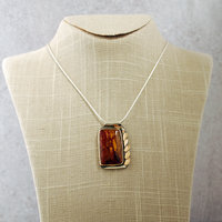 Silver and 14K Gold Pietersite Pendant hanging