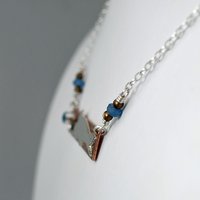 Hammered Bronze Bar Necklace with Happy Silver Fish and Blue Topaz