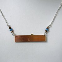 Hammered Bronze Bar Necklace with Happy Silver Fish and Blue Topaz