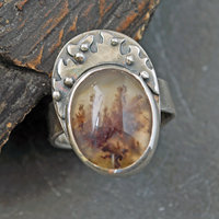Moss agate silver ring, close up view of stone and setting