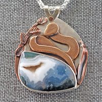 Snake pendant close-up - Agate with druzy and bronze snake above it