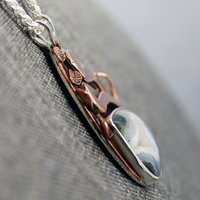 Snake pendant side view - Agate with druzy and bronze snake above it
