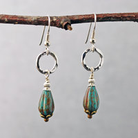 Silver ring and Czech glass teal earrings hanging
