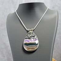 Silver pendant with Amethyst in Quartz cabochon, silver falling star above stone, hanging