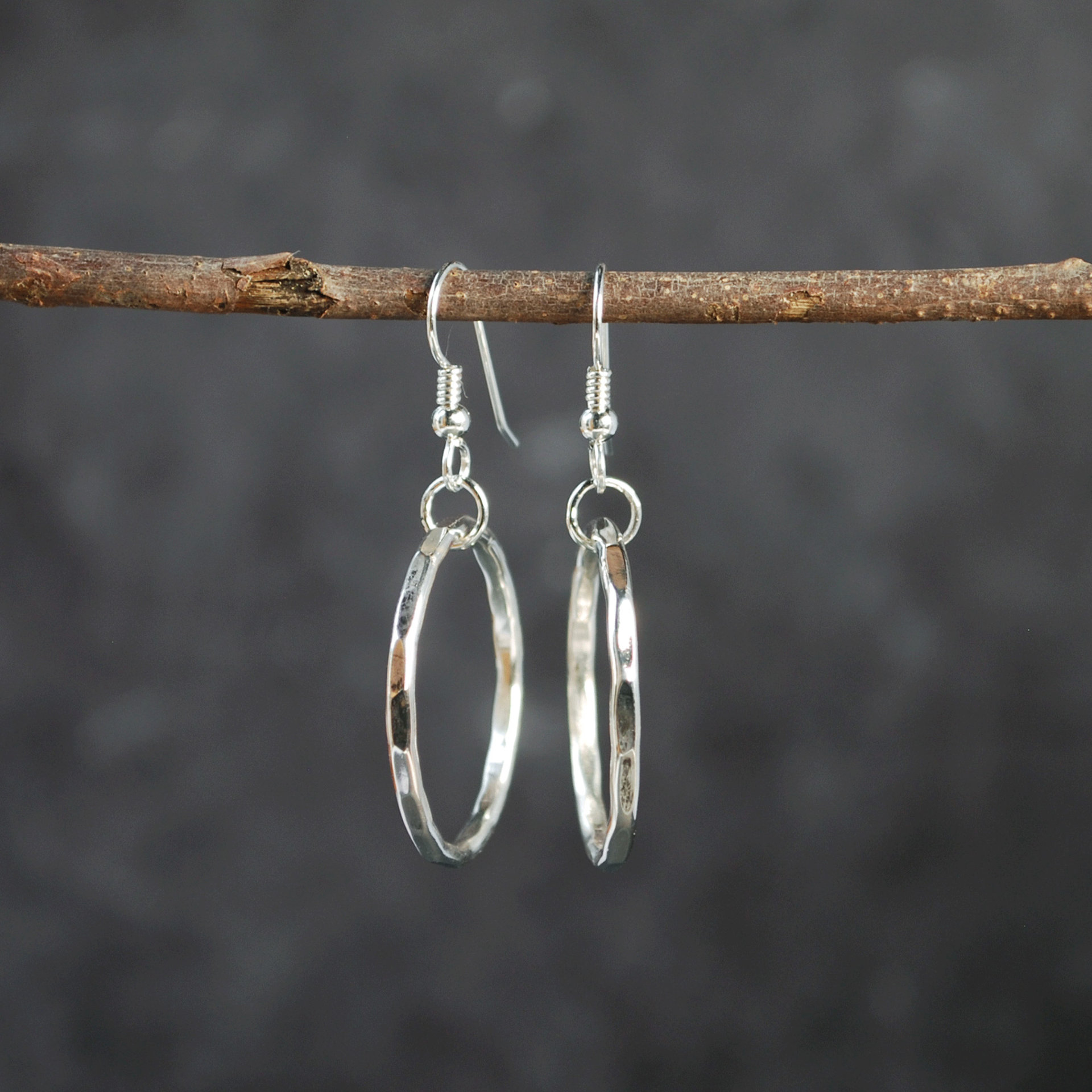 Silver Hoop Earrings hanging as worn