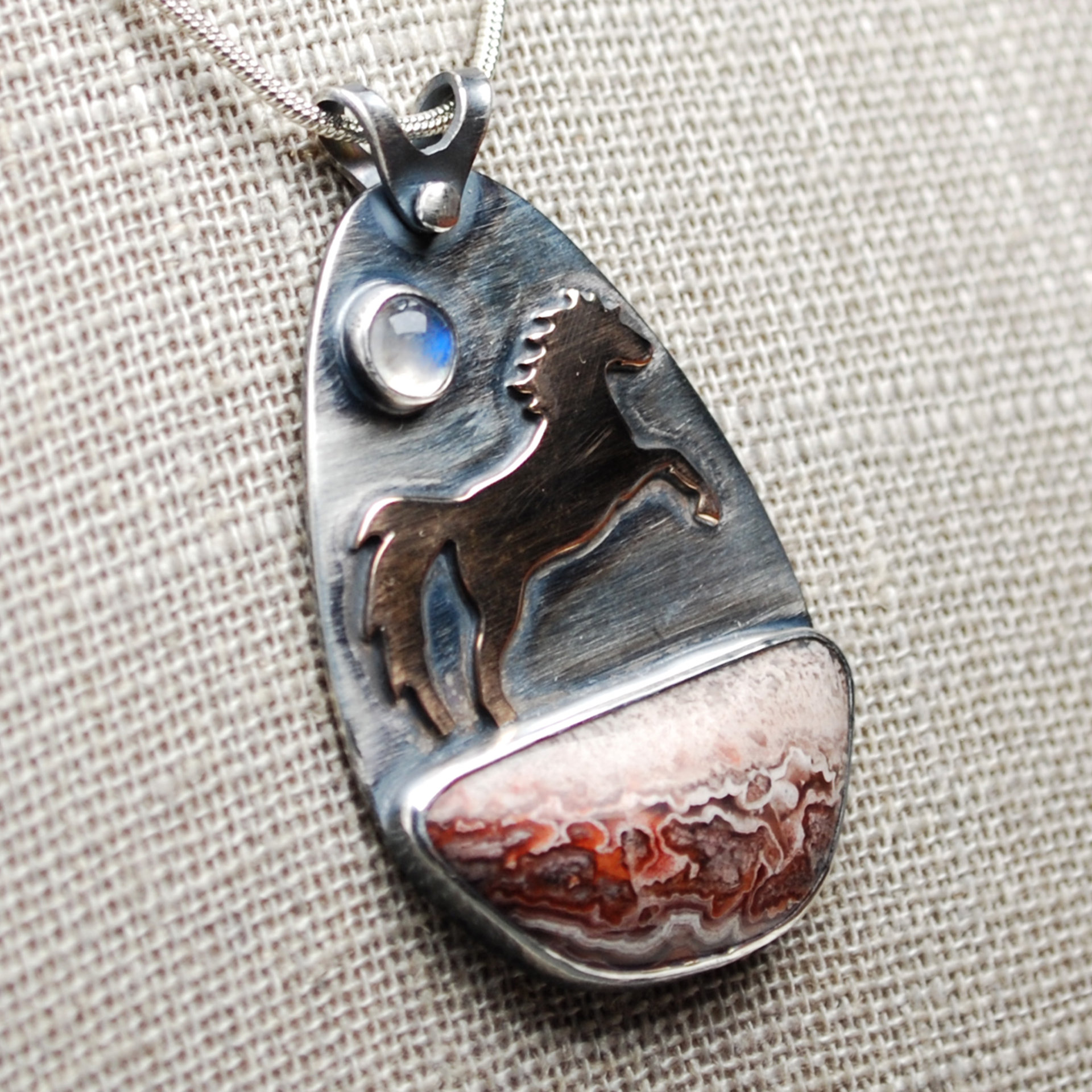 Crazy Lace Agate Pendant with Horse, Moonstone close-up angle
