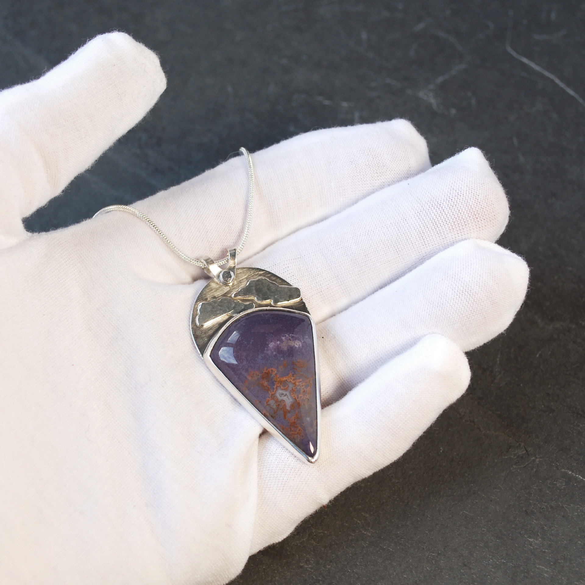 Burro Creek agate pendant in hand