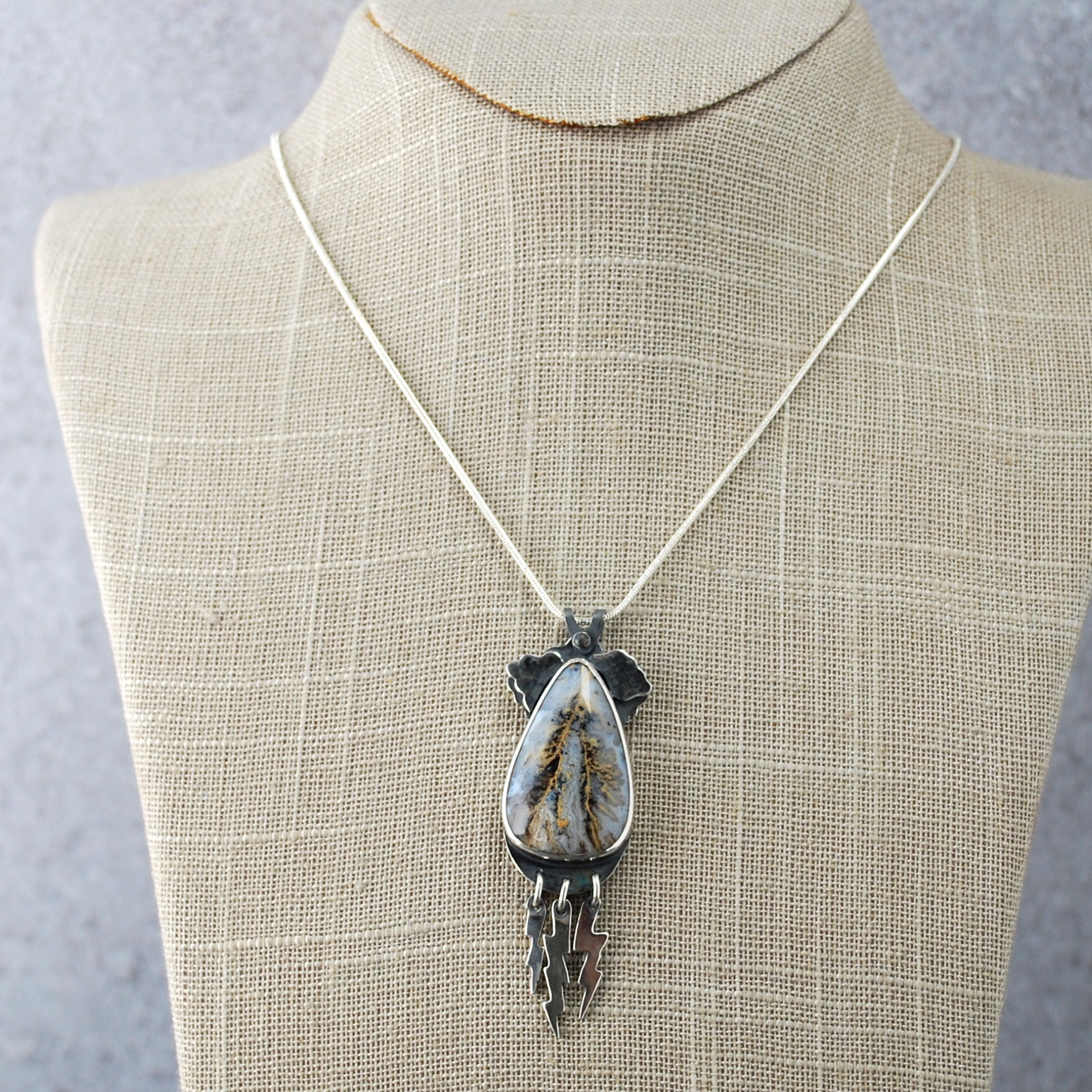 Graveyard Point Plume Agate Pendant with Lightning Bolts, hanging