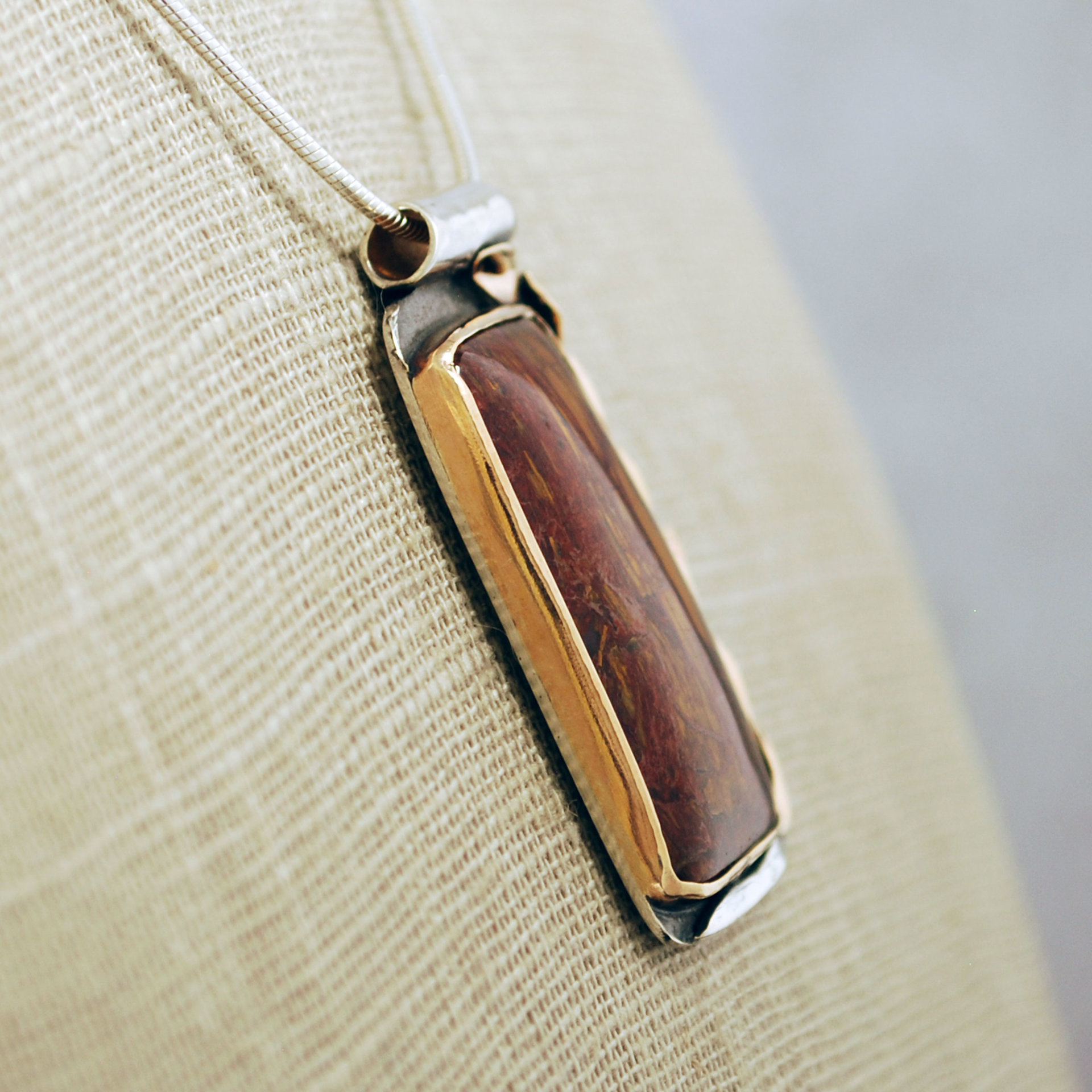 Silver and 14K Gold Pietersite Pendant close-up side view