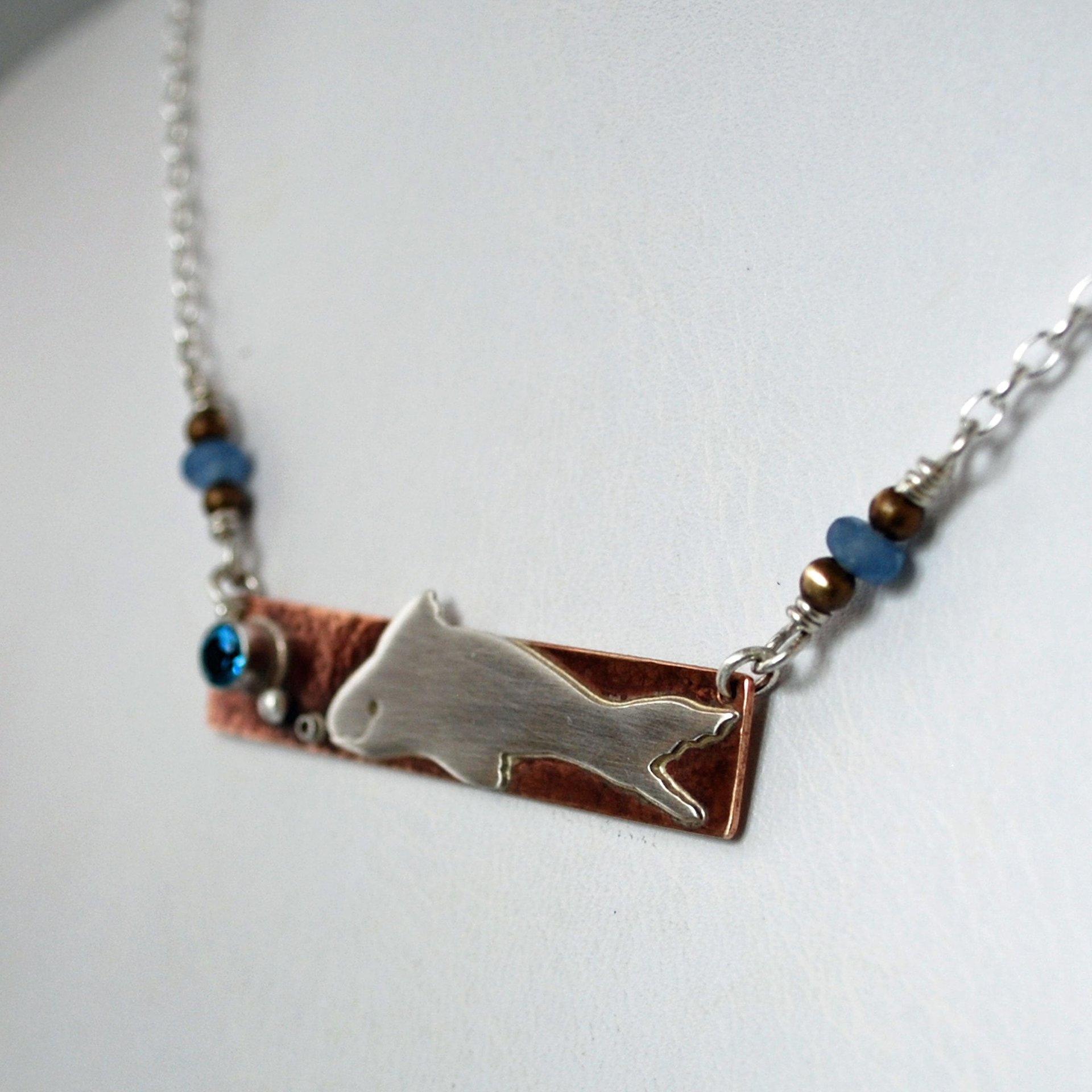 Hammered Bronze Bar Necklace with Happy Silver Fish and Blue Topaz