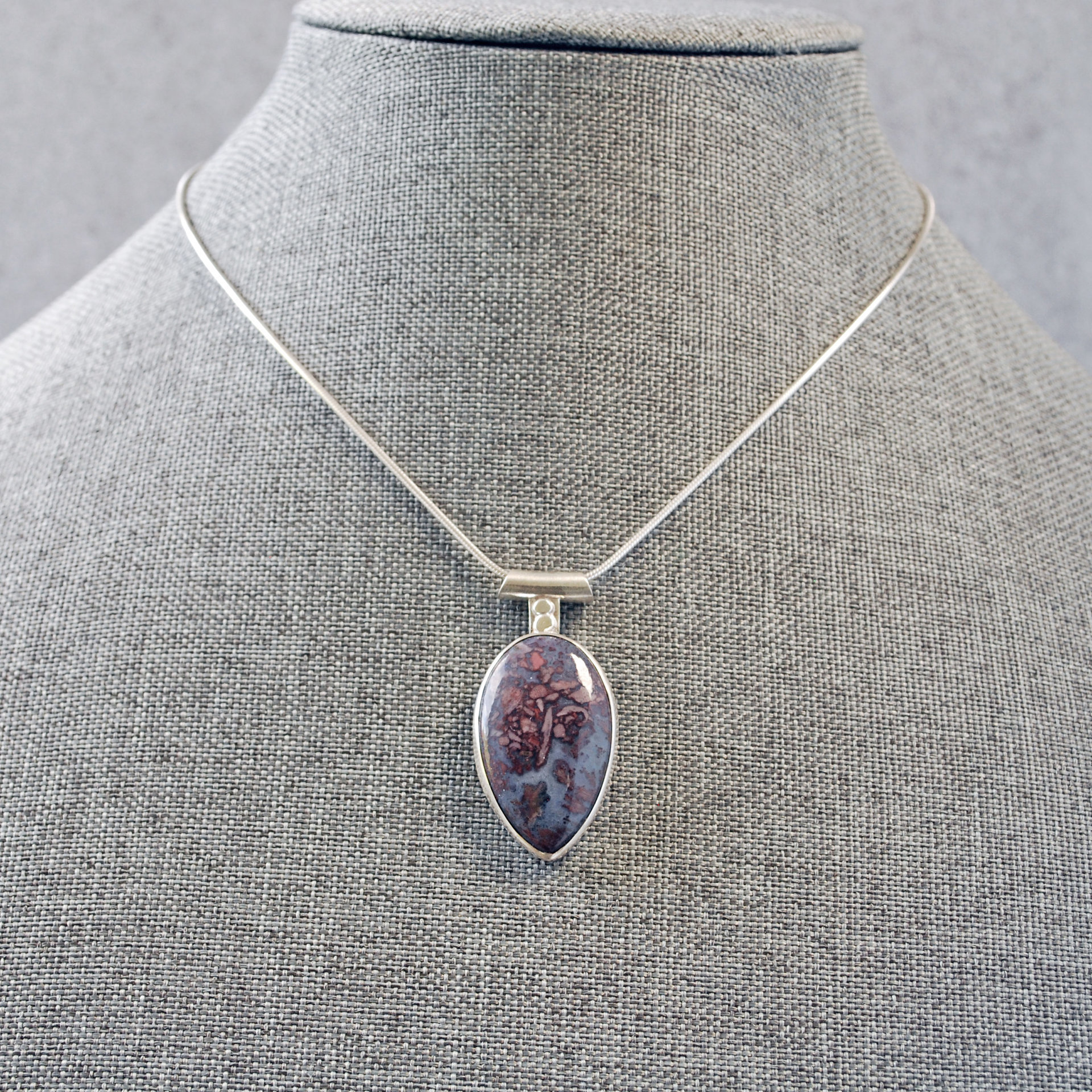Agate Pendant with Rose Cut-Out in Back, hanging on chain