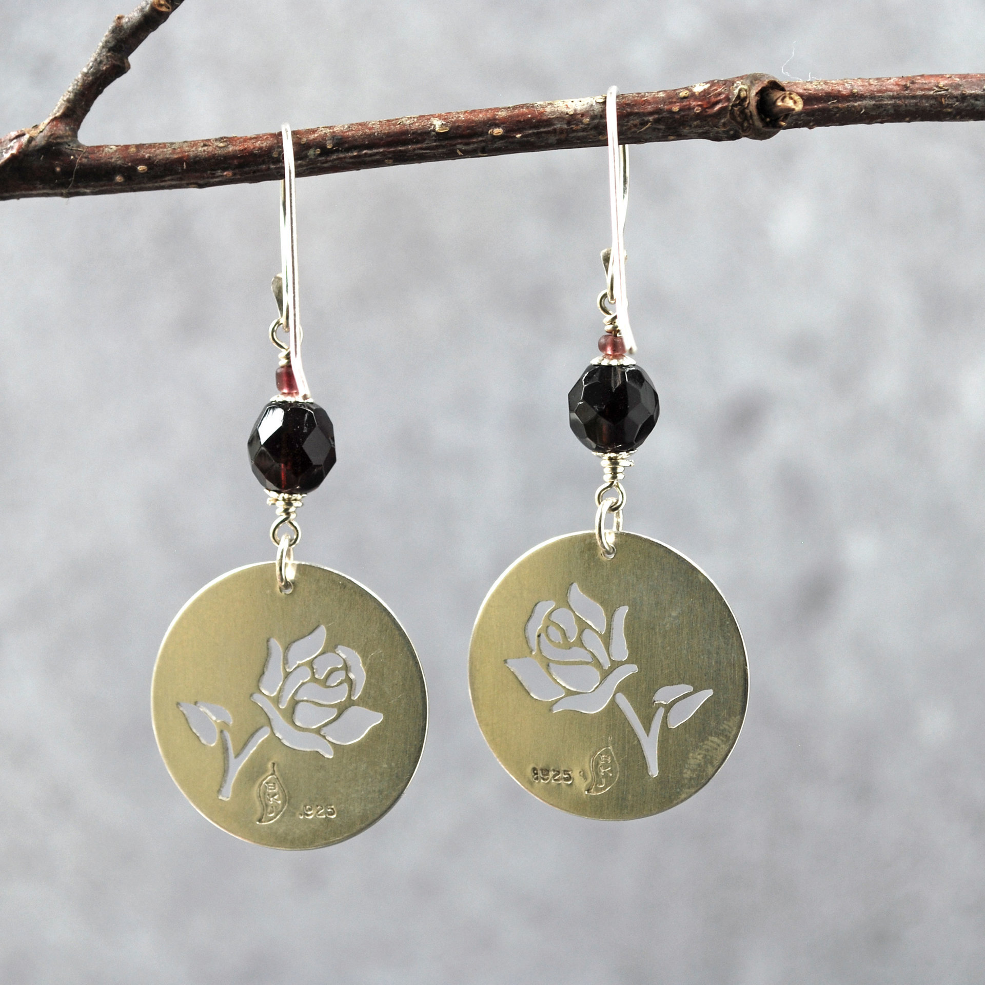 Silver Rose cut-out garnet earrings, hanging back view