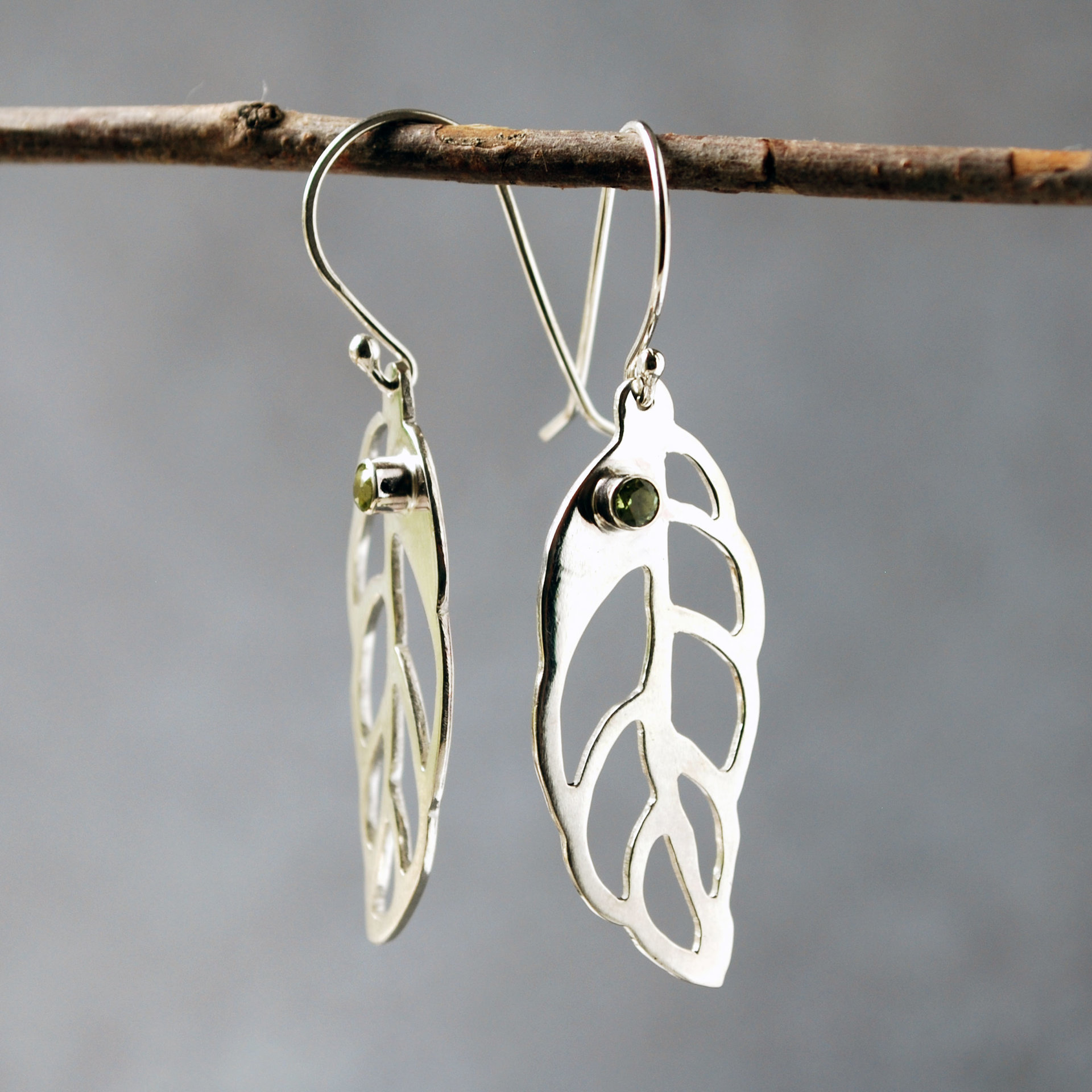 Silver Leaf Earrings with Peridot hanging angle