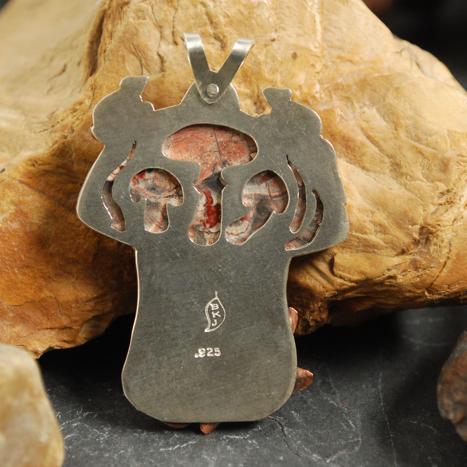 Mushroom pendant back - mushrooms cut-out behind stone